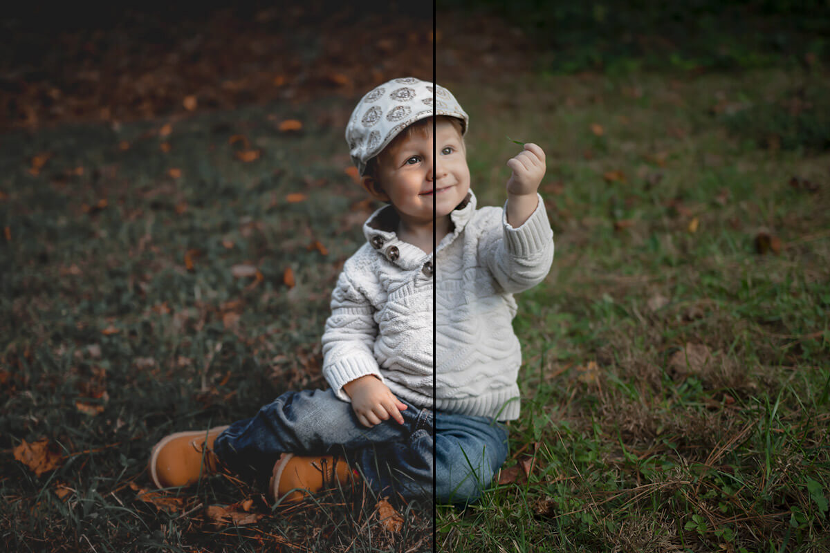 Half of this photo is color enriched and the other half is not. The photo is of a child sitting on grass and holding up a single blade of grass