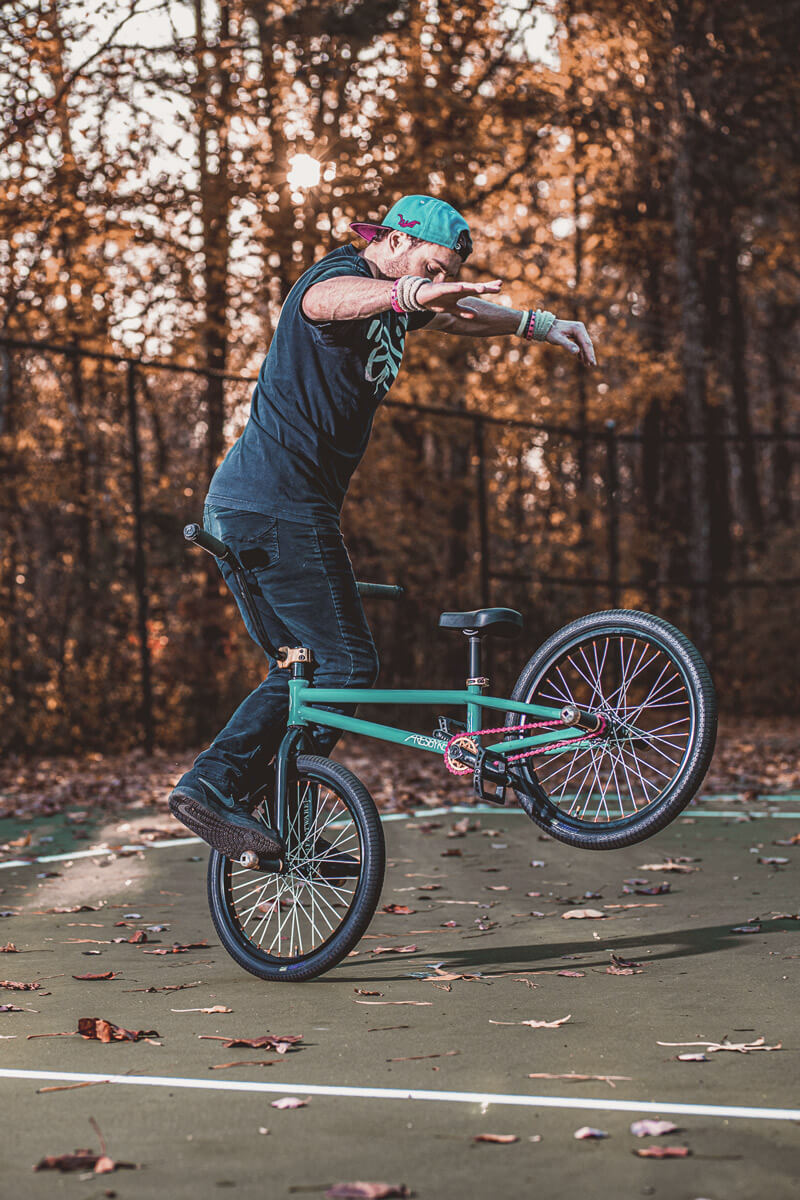 Man showing off his bicycle stunt skills for an official BMX submission